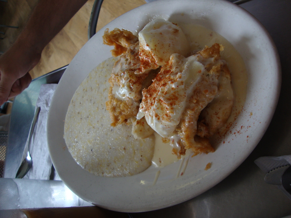 Highland Bakery, Atlanta, GA :: 2 poached eggs, 2 fried chickens, cheese, 1 biscuit, a whole lotta gravy, and a side of heavenly grits