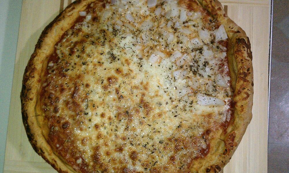 new britain ct :: pizza made from aunt vests's dough recipe, really good stuff! half cheese other half cheese + onions. got another ball of dough ready for tomorrow nights' dinner