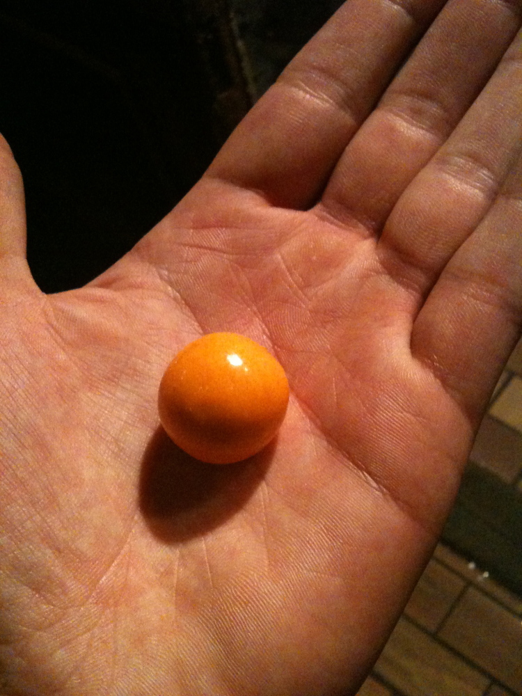 ??? :: this is an orange flavored gum ball that I ate for a snack!