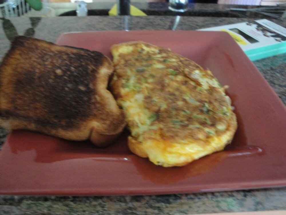 The Shire :: Green Peppers, Onions, and Mexican Cheese Mix Omelette.  And a slightly burnt piece of whole wheat toast.  HOMEMADE and fantastic!
