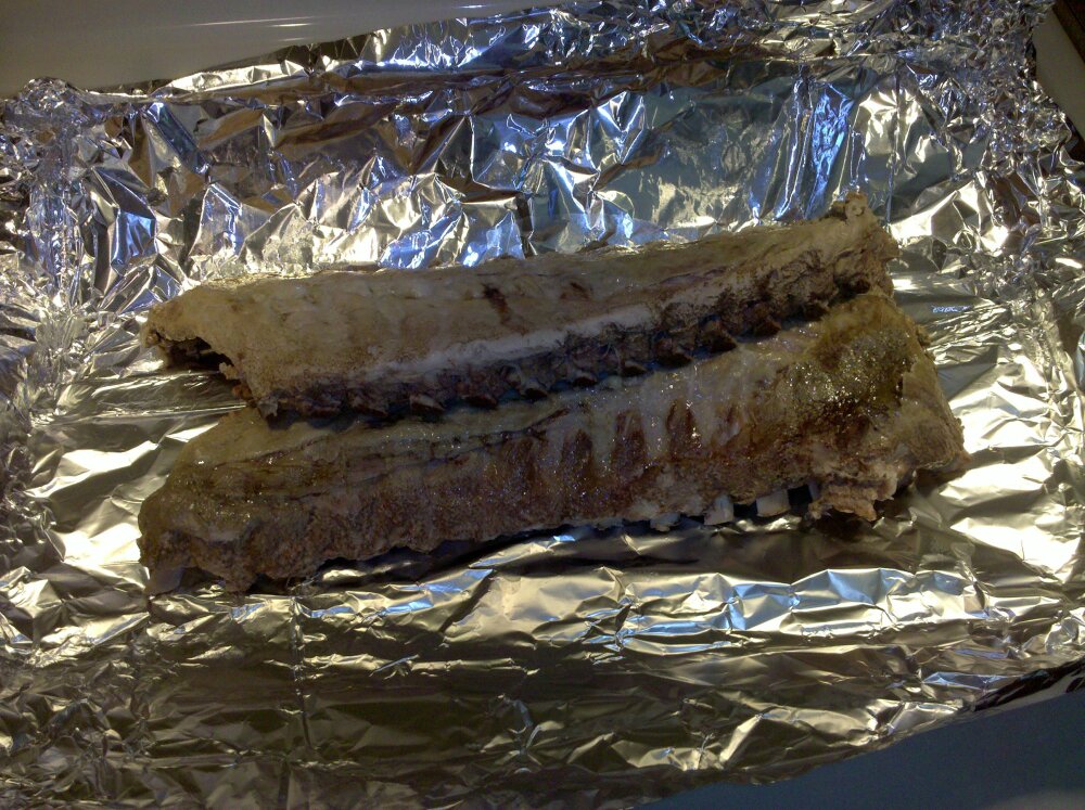 Milford, NH :: 6 lbs of babyback ribs baked in water in the oven at 250 degree F for 3 hours with some liquid smoke, see pictures with them on the grill tonight 