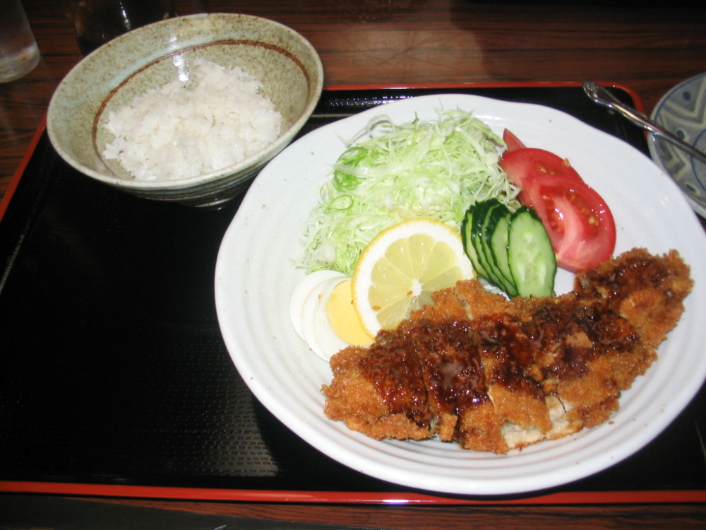Tokyo :: My first post on this site! This is perhaps my favorite Japanese dish, Tonkatsu. It's a pork cutlet breaded with panko with sause on top served with rice. So good!