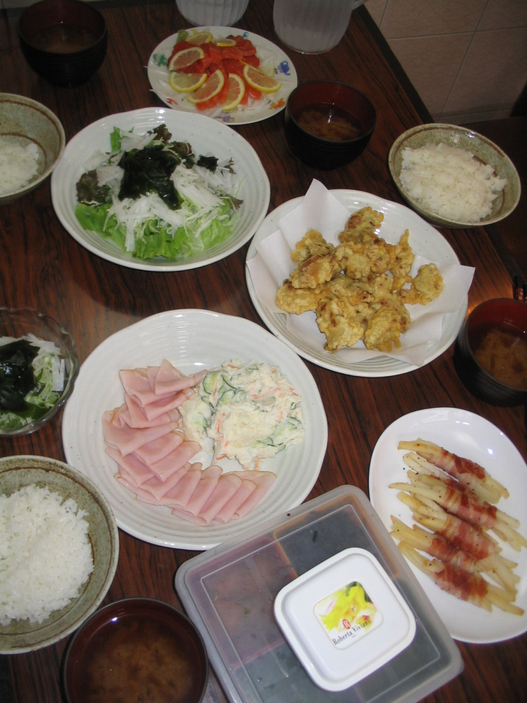 Tokyo, Japan :: Another meal at my friend's parent's place. I have to say the meals in Japan were very delicious. Here we have some sashimi, seaweed salad, some kind of tempura, ham/salad, and take special note of the french fries wrapped in bacon!