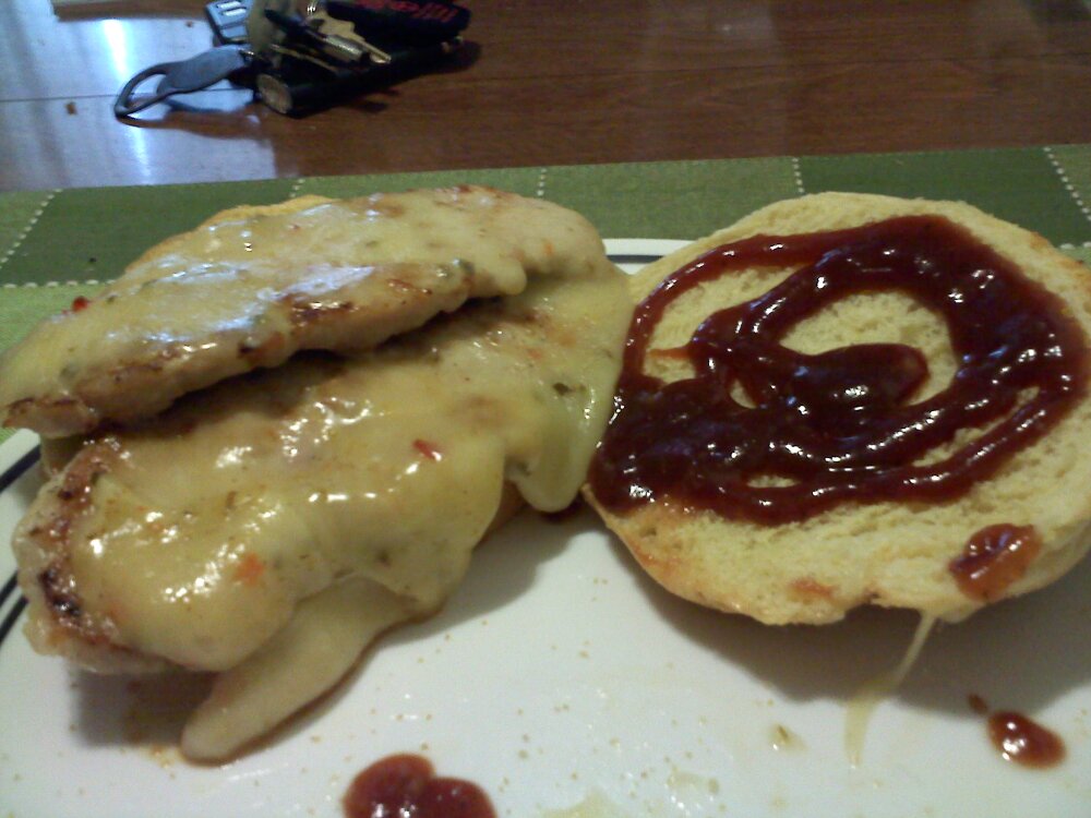 Jeff's house :: 2 pieces of pork, jalepeno cheese, bbq sauce, on a corn dusted roll! Amazing!