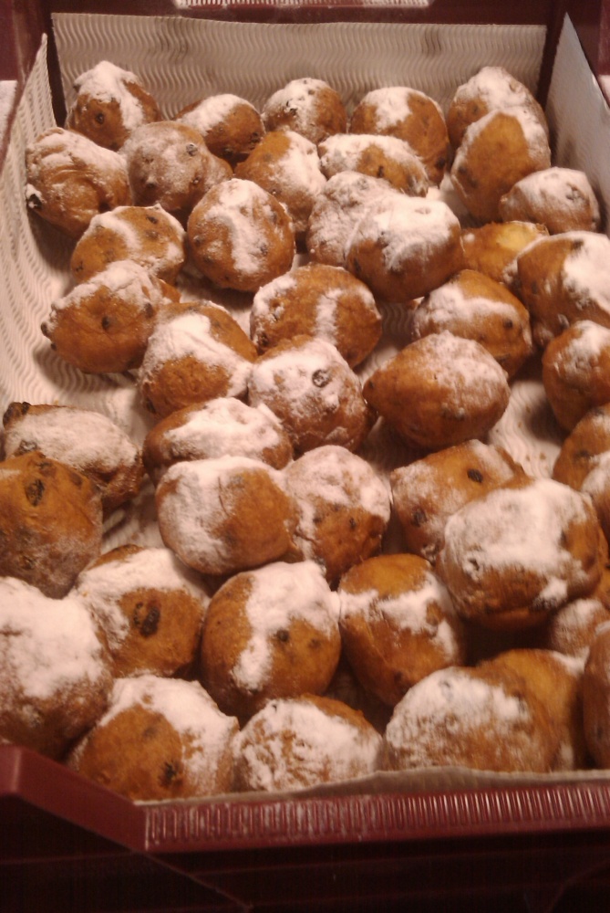 naaldwijk Holland :: dutch oliebollen.. this is a original dutch treat, deepfried dough filled with raises and topped with sugar. this is where the donuts are copied from!