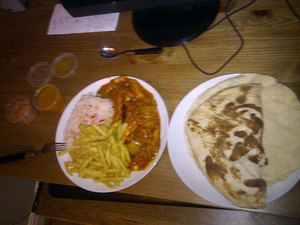 manchester, uk :: can never say no to a good curry. chicken dansak with pilau rice an garlic naan mmmm