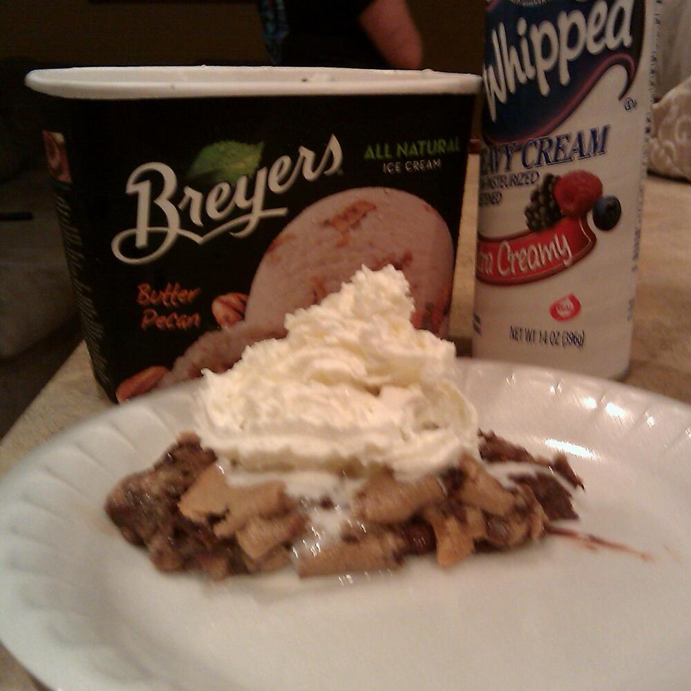 AZ :: Your looking at : semi cooked cookie dough. peacan butter ice cream. and whip cream on top.