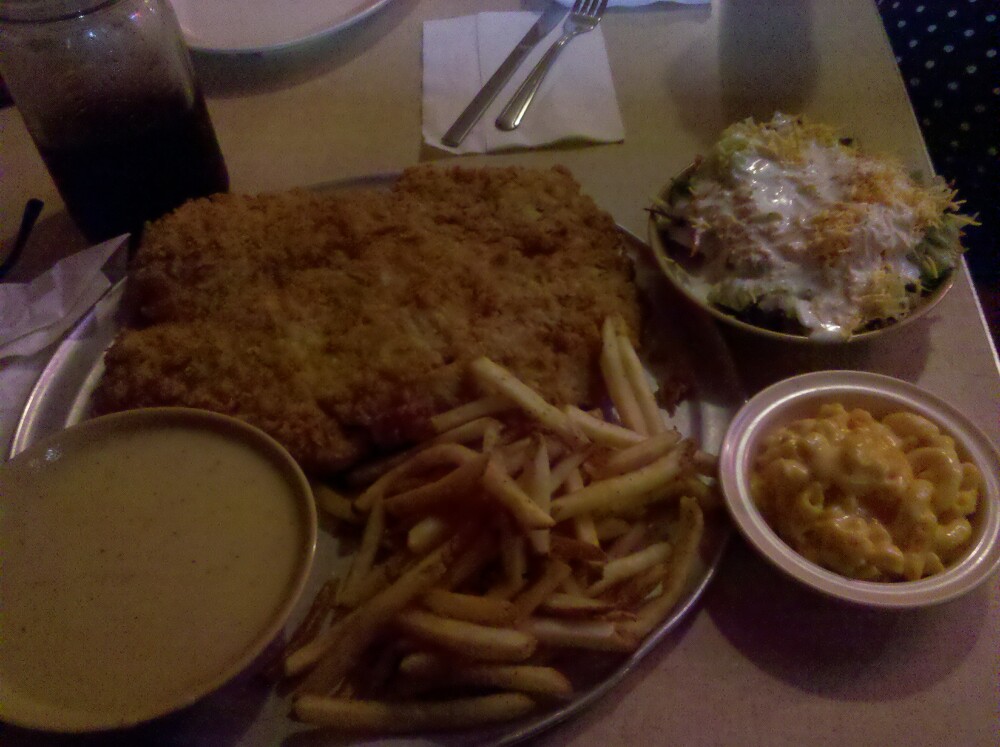 Hickory Hollow. TEXAS :: Everything's bigger in Texas, including this Chicken Fried Steak. So big it's served on a pizza tray. Fries and the MacNCheese was Tha Shhizzzz