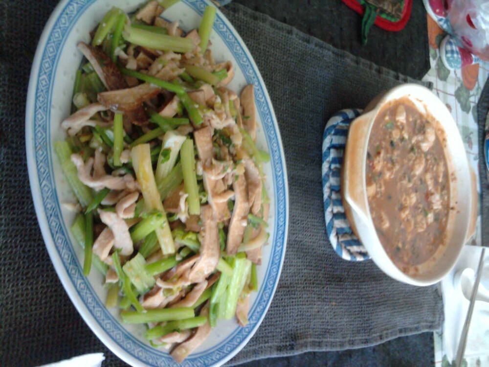 eastern ct :: shredded pork and 5 spice doufu with chinese celery. in the back pot,mother chen's mapo doufu-a spicy mix of ground pork,doufu in a firery sauce. 