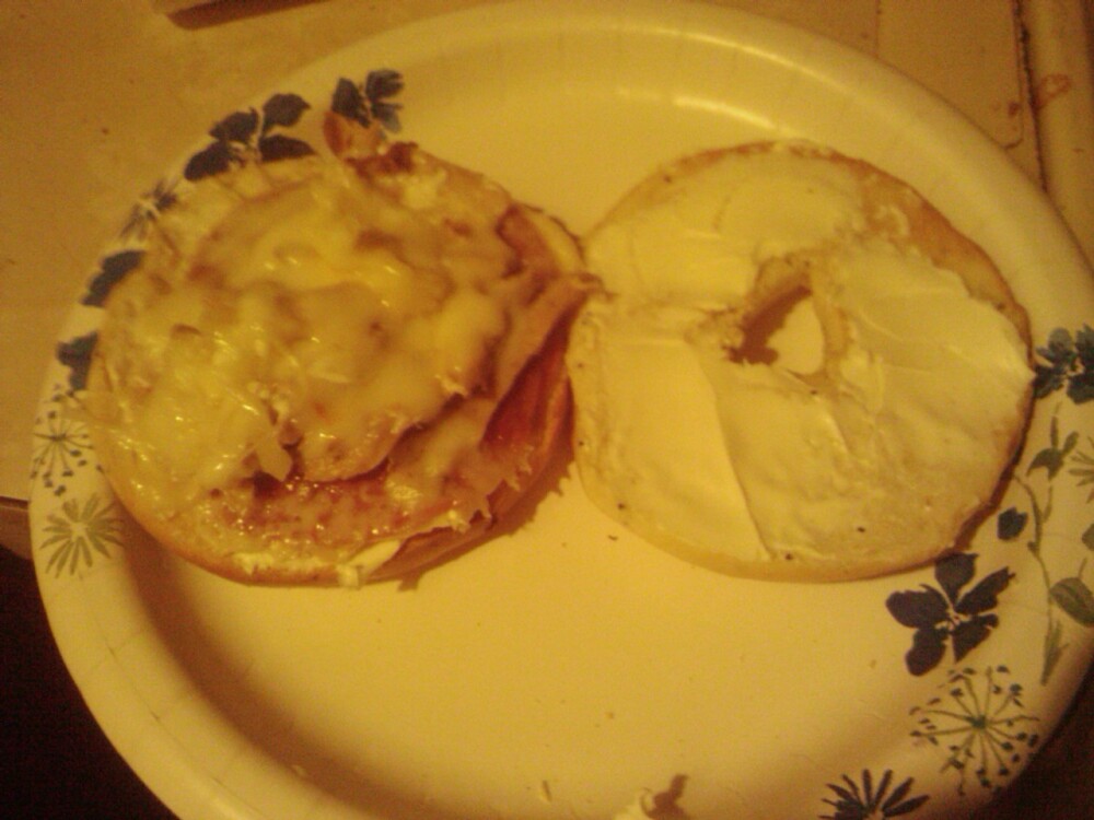 vancouver, wa :: came home drunk and starving... and this was the result. a toasted onion bagel with cream cheese and then salami and leftover turkey smothered in melted provolone cheese
