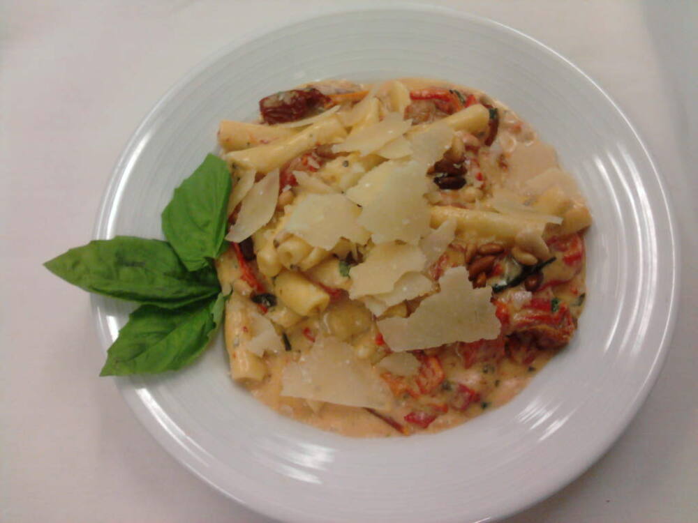 eastern ct :: strotsapretti pasta with roasted tomatos,roasted red peppers in a light pesto cream with shaved parmesean. 