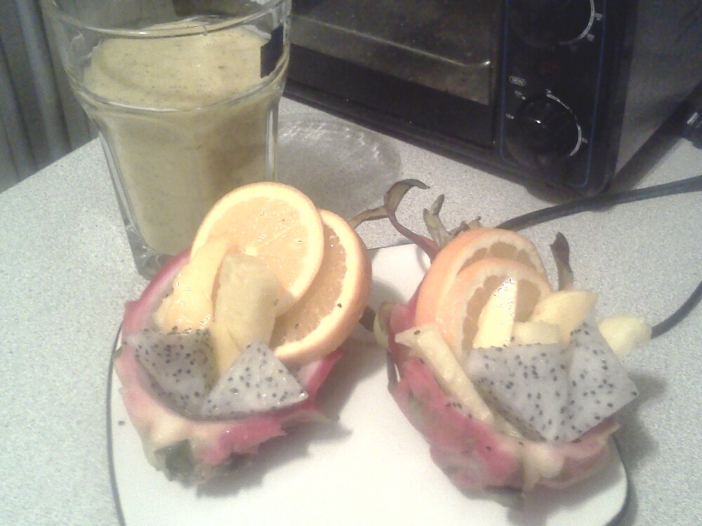 Montreal :: hollowed out half dragon fruit filled with pineapple,orange, mango and dragon fruit. 