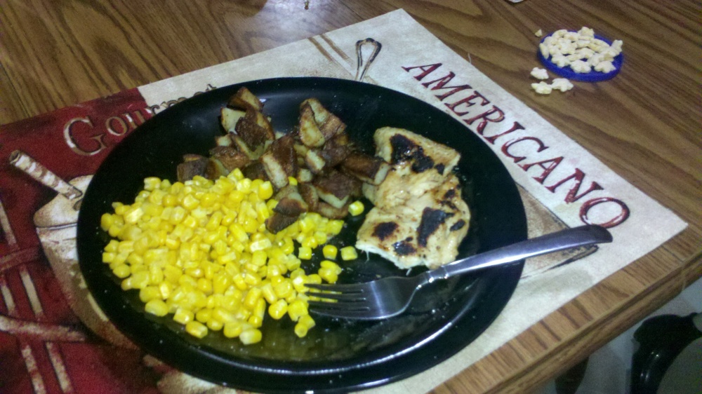 new britain ct :: chicken baked in italian dressing and then fried for a few minutes, steamed sweet corn niblets and some fried potatoes. and on the side there is some sweet potato gerber baby puffs for the little guy!