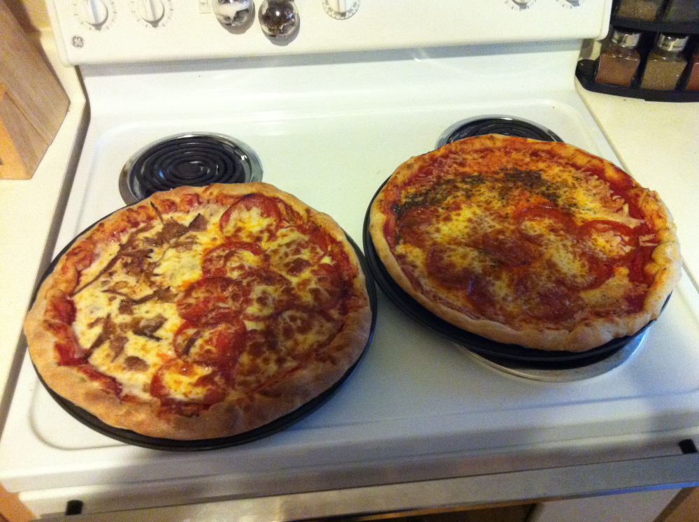 Austin, TX. :: I made pizza for friends. Russ had a really good idea. We lined the crust with Gouda. The pizzas were 50/50 cheese and pepperoni. One of them also had brisket. Also, wheat dough was used. Not my call. Came from WholeFoods but it was really good. 