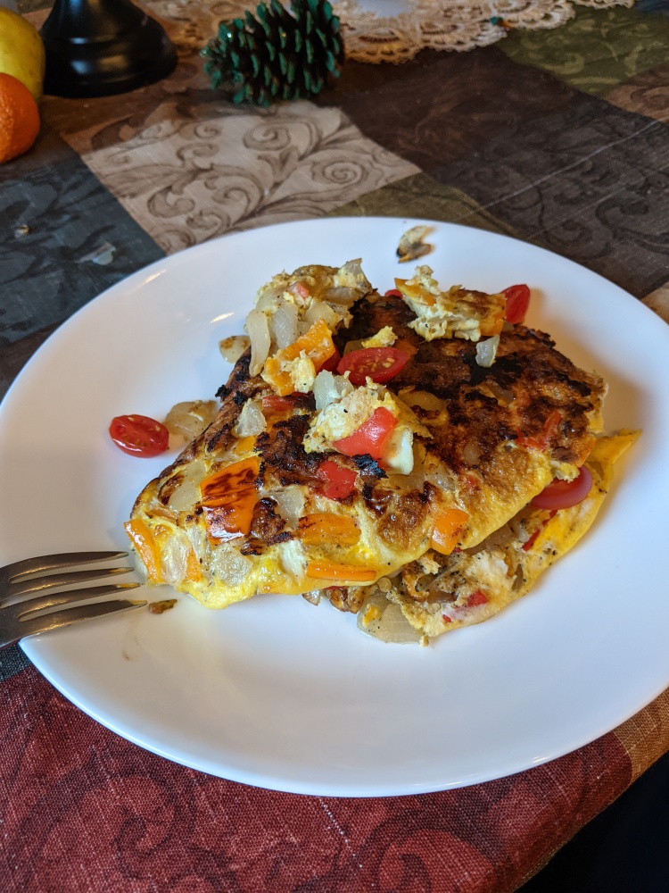 Plainville, CT, USA :: Sunday morning omelette. Tomato onion pepper sharp cheddar cheese