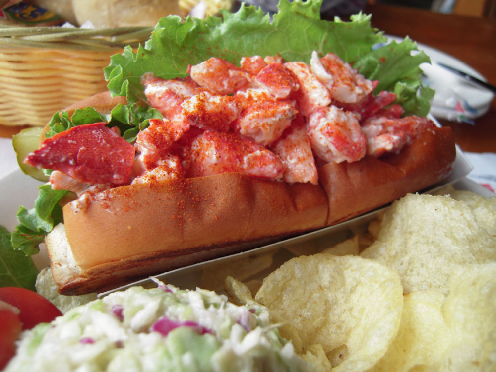 Bailey Island, Maine :: Lobster Roll, pickle, chips and coleslaw in its award winning dressing." On the menu it said "almost a whole lobster in each lobster roll"" why not put the rest of the dang thing in there???" the coleslaw was mushy!
