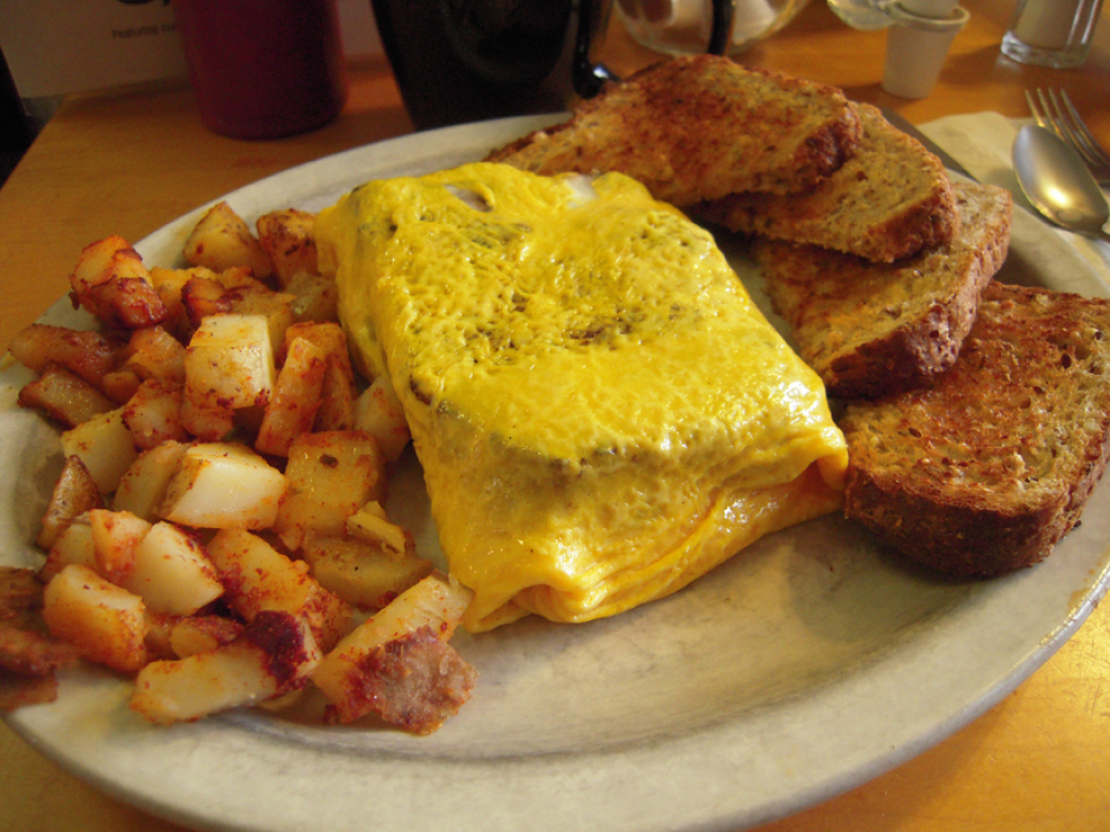 River House Cafe Milford, NH :: what do you think this is???? it looks like an omelet but why is there a square chunck of Meat-Loaf in the middle?? oh I know... it is a meatloaf omelet! 
