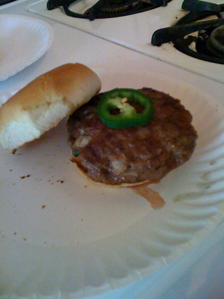 My house Cambridge, MA :: Seth made some burgers with a hot pepper in it and some onion... really yummie burger!!!!!!!!!!  topped with a slice of hott pepper just for an added kick!!  I ate mine in like 4 bites!!