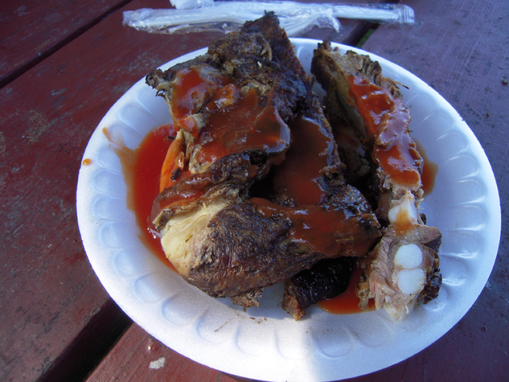 Curtis BBQ Putney, VT :: some ribbs and some chicken topped with some BBQ sauce!  there is a very large big that runns around too...