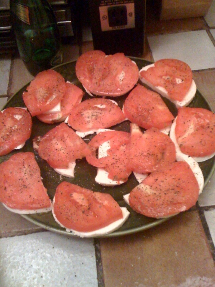 My House Cambridge, MA :: one large heirloom tomato that I grew sliced on the thick side and a pound of Vermonts Maplebrook Mozzarella!!!! added a little S&P and I ate more of it... saved some for lunch/snack tomorrows...  I snuck a few large sliced of the cheese to eat!!  