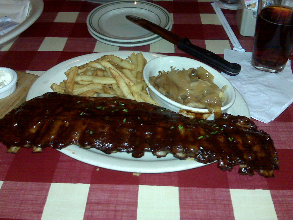 Bugaboo Creek Steakhouse Nashua NH :: Full rack of smoked bbq baby back ribs with seasoned fries and grilled onions.  newcastle brown ale for drink!