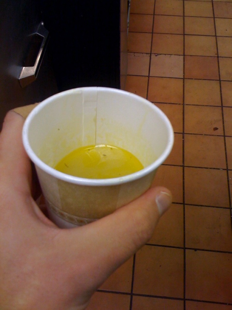 Marriott Kitchen Cambridge, MA :: this is a cup of chicken noodle soup... but I only took the liquid part... I did not have a spoon and just wanted to sipp on something warm.  I dont think you can call what I ate chicken noodle anymore....