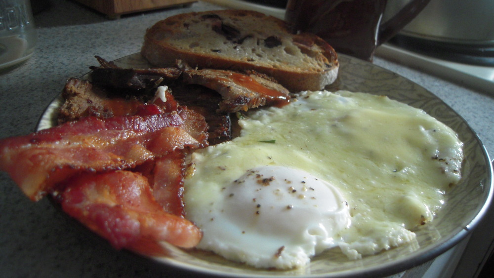 Portland, ME :: GUY'S BREAKFAST! 
Pot roast with Texas Pete, bacon, 2 sunny-side-up eggs with sharp cheddar, and buttered kalamata olive sourdough toast.
