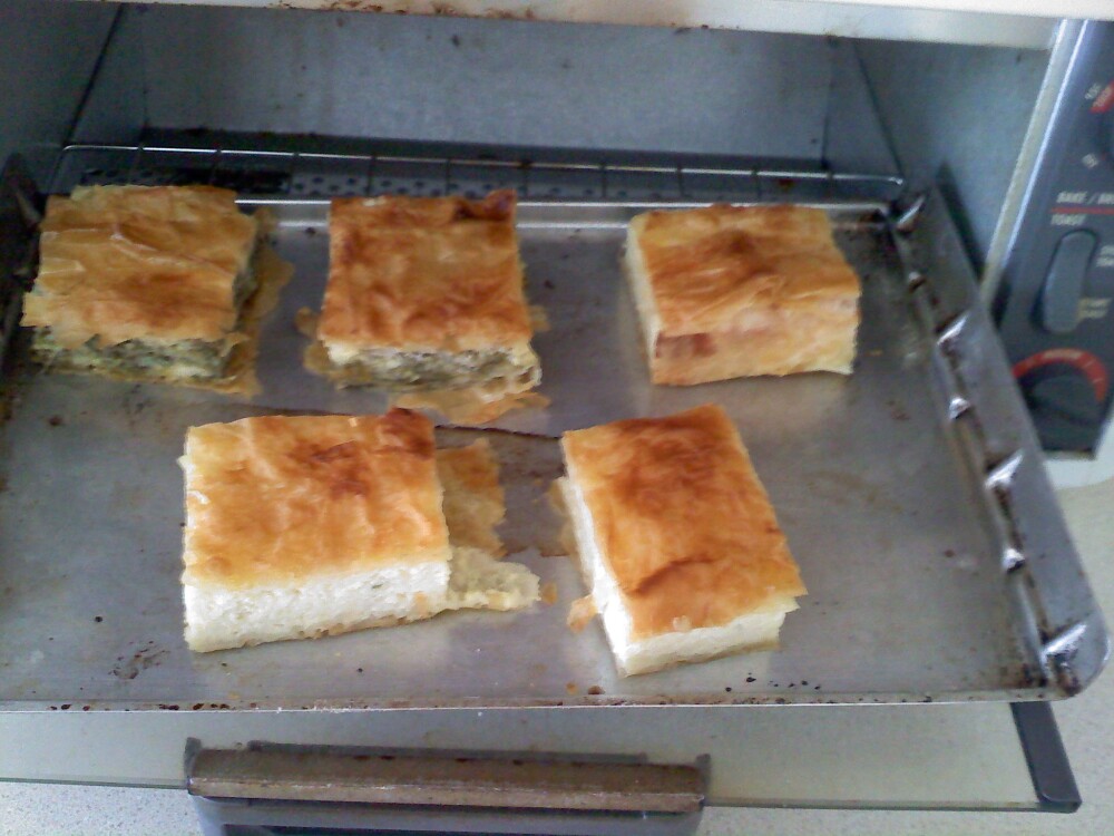 Nashua, NH :: Greek Spanakopita and Tiropita (Much like those spinach triangles that people serve as hors d'oeuvres)

Spanakopita is made with spinach and feta
Tiropita is made with egg and feta