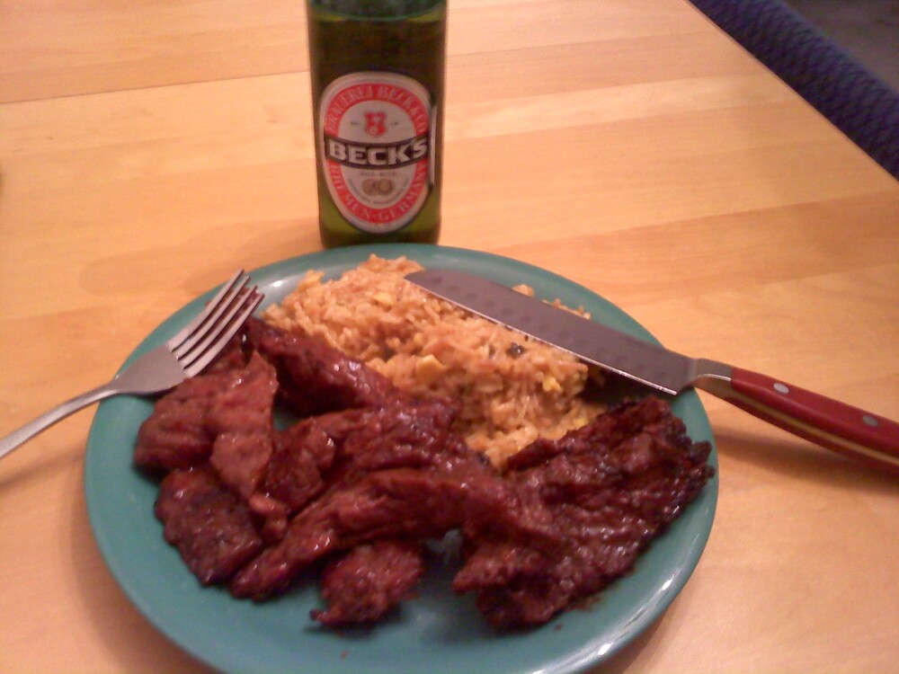 Nashua, NH :: Steak Tips marinaded in BBQ sauce, some Spanish rice and Becks.  Oh yah ... ran outta steak knives, so I had to use that one :-)