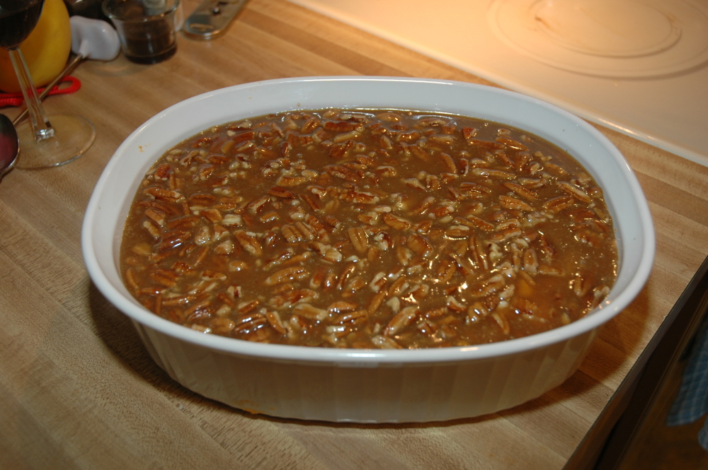 Home, Milford, NH :: Sweet Potato Praline Casserole:
5 large sweet potatoes or yams
1/2 cup (1/4 pound) softened butter
1/2 cup white sugar
2 eggs beaten
1 teaspoon vanilla
1/3 cup milk
1/2 cup heavy cream
1 cup light brown sugar
1/3 cup melted butter
1 cup chopped pecans
