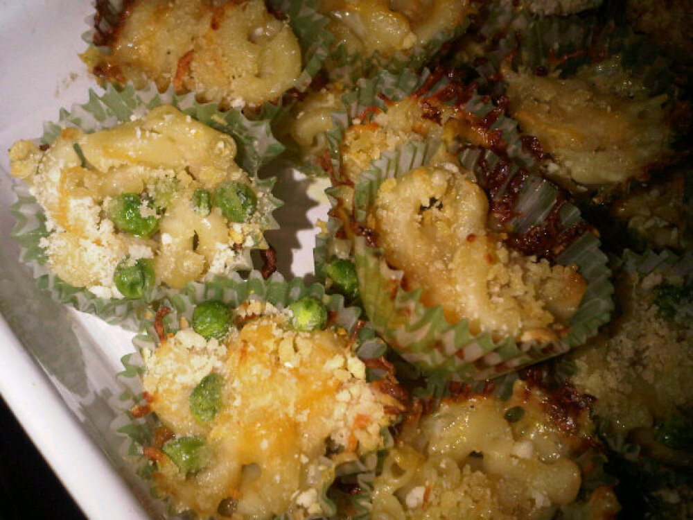 southie/mi casa :: baked mac n cheese in mini muffin tins- used romano and cheddar cheeses... also added some peas. next time will leave out the actual muffin tin...