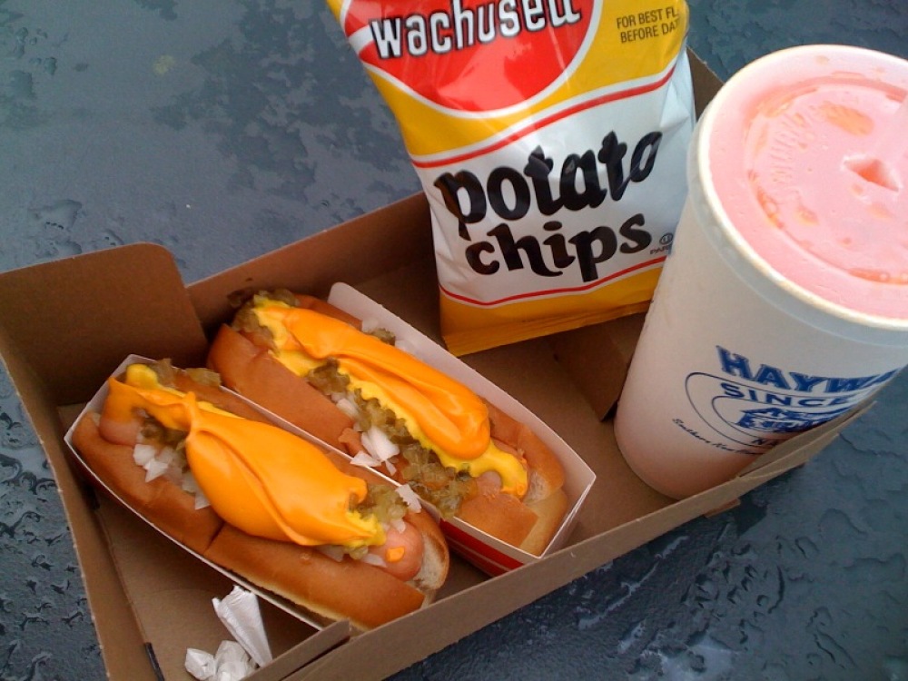 haywards milford, NH :: 2 hot dogs with some yummie fixxnz on top!! chips and an orange soda!!!!" and yes that is cheese!!!!